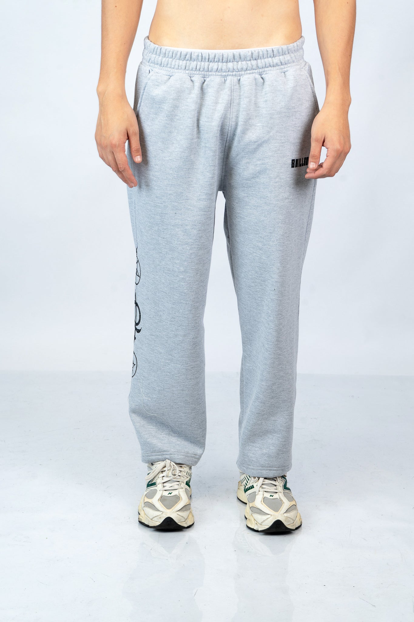 a man wearing a pair of grey sweat pants